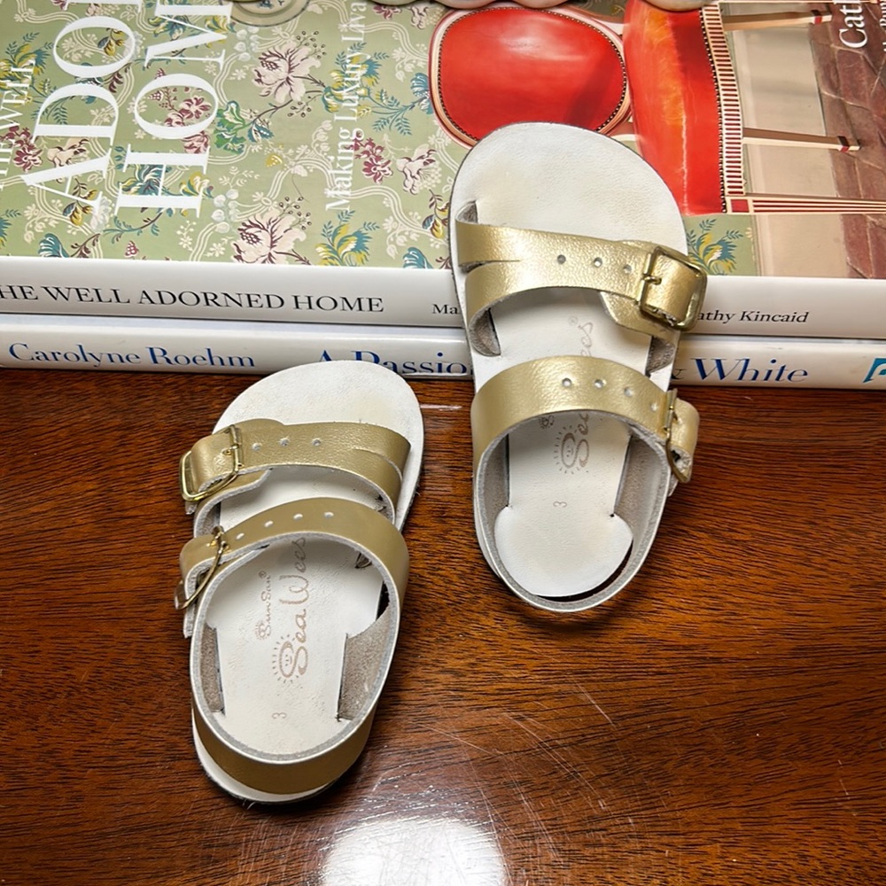 Gently used gold Sun Sans Sea Wees size 3